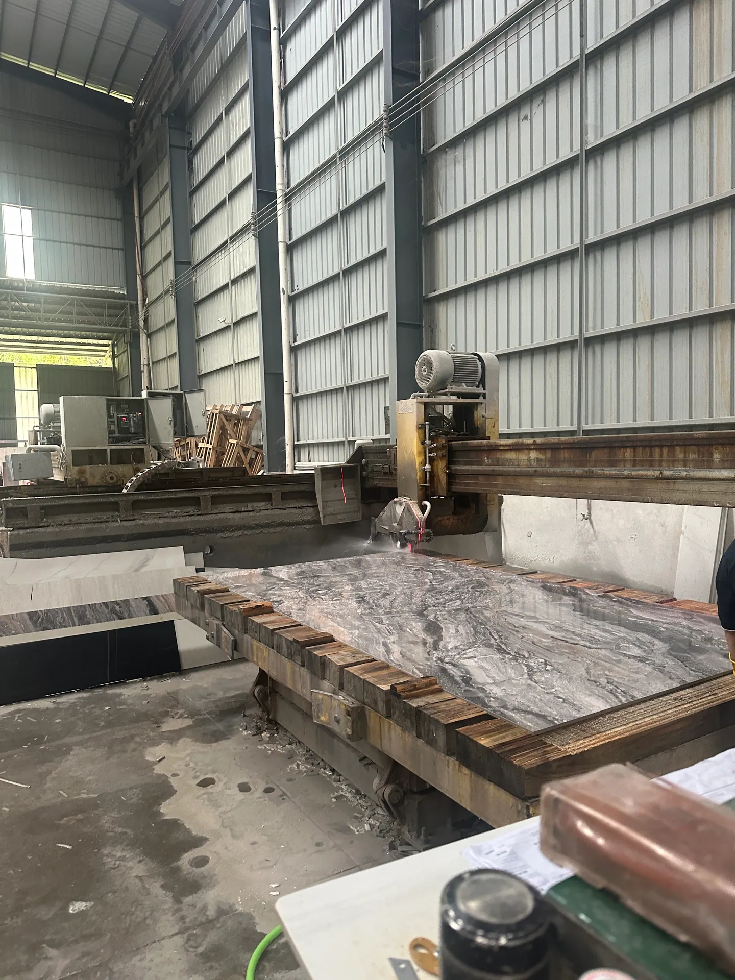 Home 4 Stone slab cutting equipment inspected for a VELA Home Global building-material sourcing project