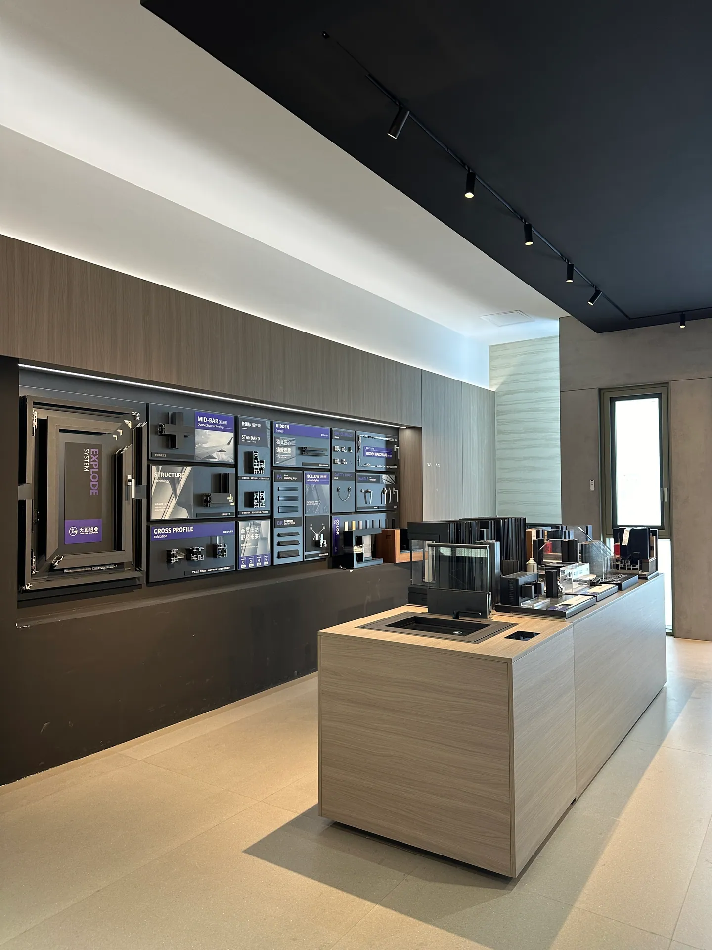 Home 5 Architectural hardware and door-system samples compared in a Foshan supplier showroom