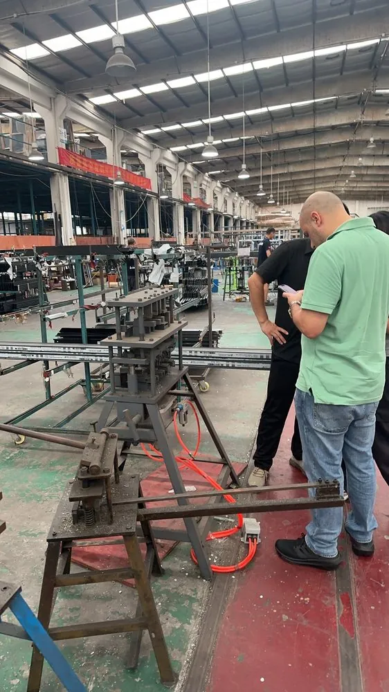Client and sourcing team reviewing products during a supplier visit in China